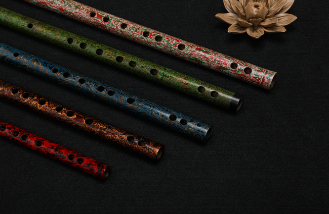 Assorted Guo Xinming Daqi Special Edition Colored Dizi flutes in red, green, blue, and brown lacquer, ideal for woodwind instrument collectors.
