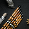 Set of Guo Xinming Professional Dizi flutes with engraved Chinese characters, showcasing premium bamboo craftsmanship and tonal precision.