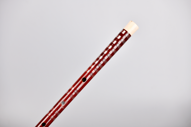 Single Guo Xinming Dizi - Premium Performance model with no joint, featuring elegant red finish and ox bone tip for rich, resonant sound.