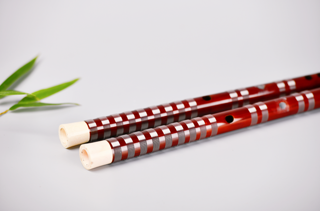 Close-up of Guo Xinming Dizi - Premium Performance, highlighting ox bone tips and detailed craftsmanship for serious woodwind musicians.